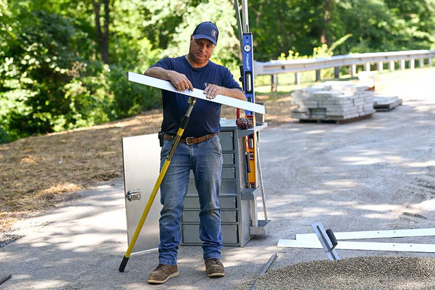 Quick-E Screeder Package screeds polymeric sand without bending over and comes with three different lengths. Made in America