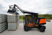 An orange and black S24 PaveJet paver laying machine laying pavers