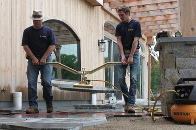 Ergo Assist is a two man handle that attaches to Pave Tools block clamps or suction equipment to lift paver slabs for hardscaping